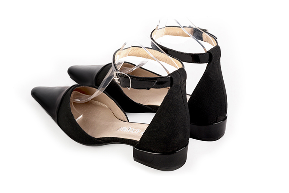 Women's gloss black and matt black open side dress shoes, with a strap around the ankle. Tapered toe. Low block heels - Rear view